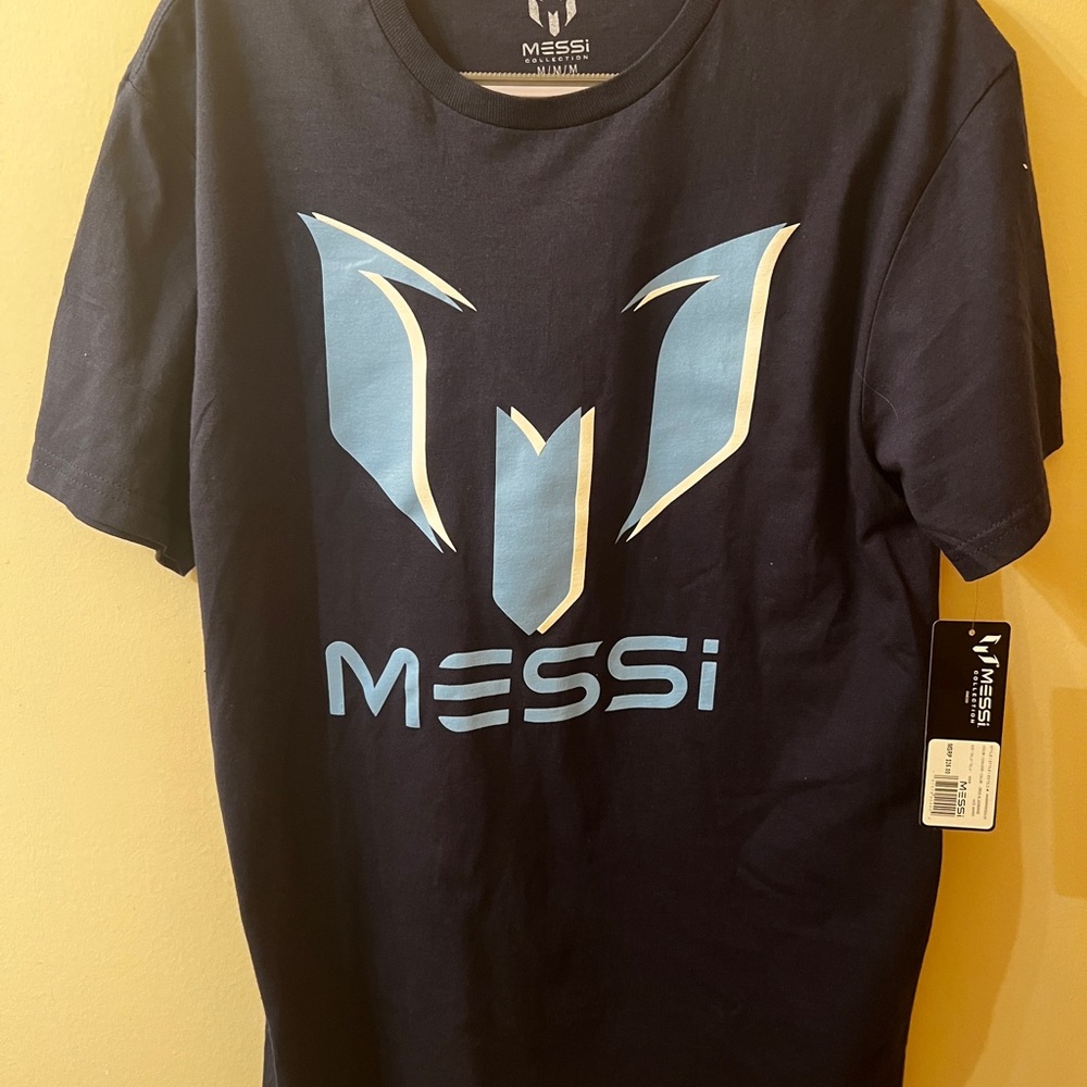 Messi Collection Medium Blue Dynamic Logo Short Sleeve Tee